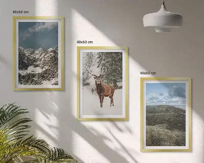 Set of 3 framed wall art pieces featuring a snowy mountain forest and deer landscape