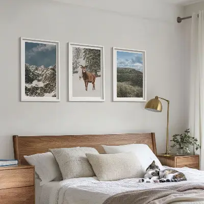 Set of 3 framed wall art pieces featuring a snowy mountain forest and deer landscape