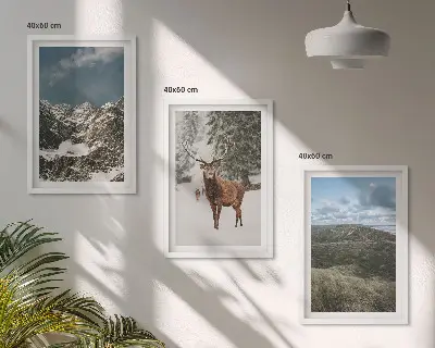 Set of 3 framed wall art pieces featuring a snowy mountain forest and deer landscape