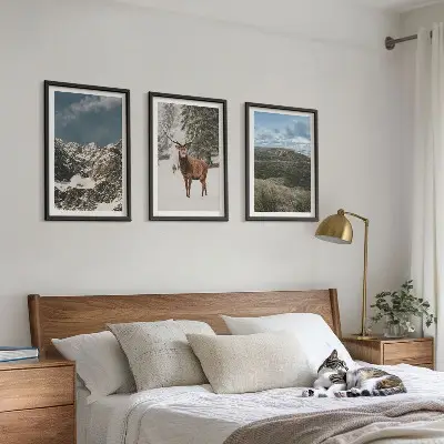 Set of 3 framed wall art pieces featuring a snowy mountain forest and deer landscape