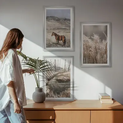 Wall art set featuring a landscape of horses in a grassy stream