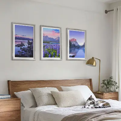 Three-piece mountain landscape wall art featuring water and sky scenery