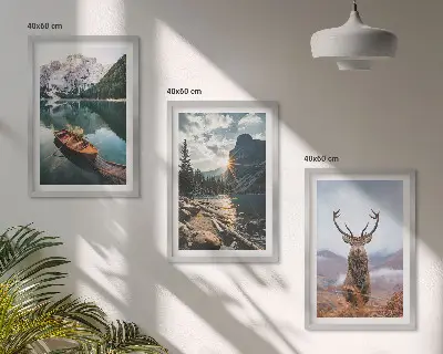 Three-piece wall art set featuring a mountain lake, boat, and deer at sunset