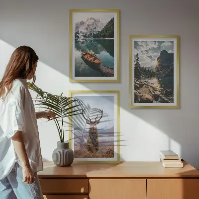 Three-piece wall art set featuring a mountain lake, boat, and deer at sunset