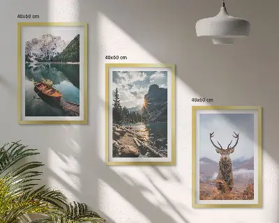 Three-piece wall art set featuring a mountain lake, boat, and deer at sunset