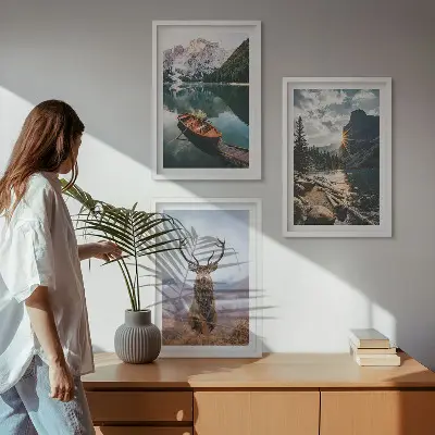 Three-piece wall art set featuring a mountain lake, boat, and deer at sunset