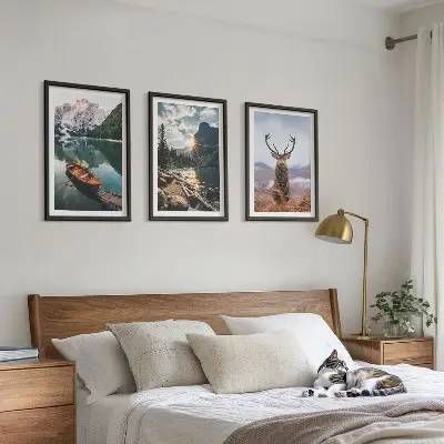 Three-piece wall art set featuring a mountain lake, boat, and deer at sunset