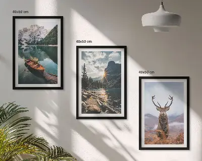 Three-piece wall art set featuring a mountain lake, boat, and deer at sunset