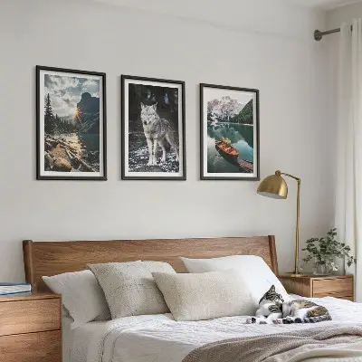 Set of 3 framed wall art pieces featuring mountain lake and wolf nature scenery