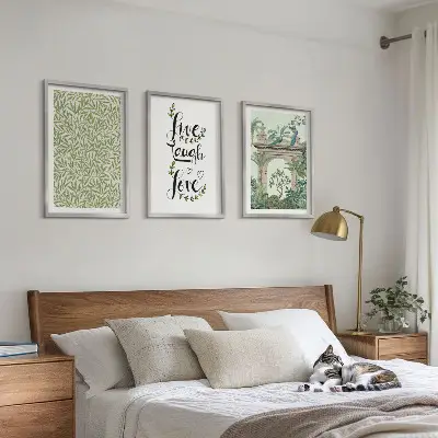Set of 3 framed wall art pieces featuring green botanical leaf architecture