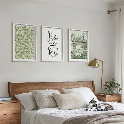 Set of 3 framed wall art pieces featuring green botanical leaf architecture