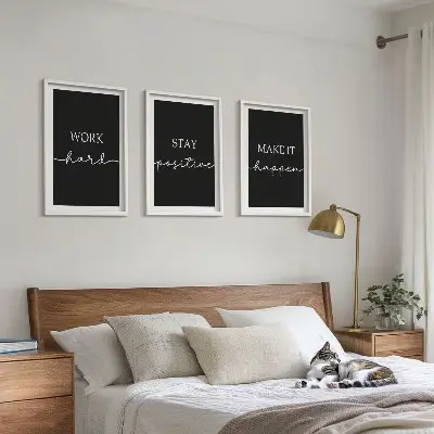 Three-piece wall art set with elegant motifs on black