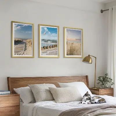 Wall art set featuring a coastal beach scene with sand, waves, sky, and birds