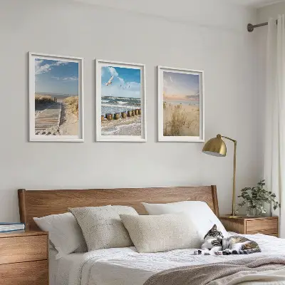 Wall art set featuring a coastal beach scene with sand, waves, sky, and birds