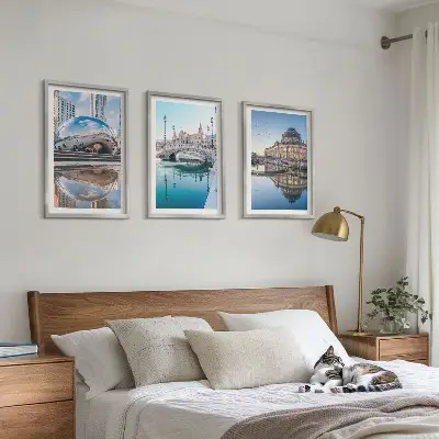 Set of 3 framed wall art pieces featuring architecture of cities on water