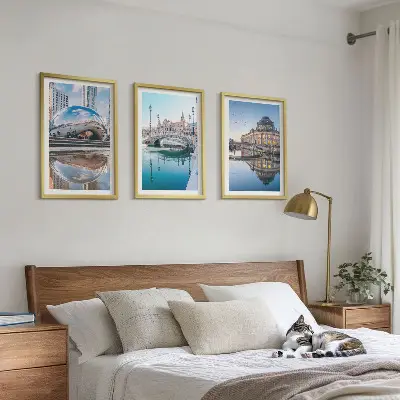 Set of 3 framed wall art pieces featuring architecture of cities on water
