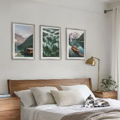 Wall art set featuring a mountain lake with a boat surrounded by foggy forest