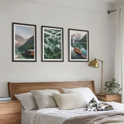 Wall art set featuring a mountain lake with a boat surrounded by foggy forest