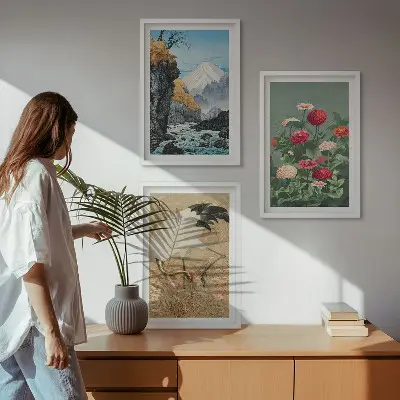 Set of 3 framed wall art pieces featuring a mountain landscape with a river, flowers, and cranes