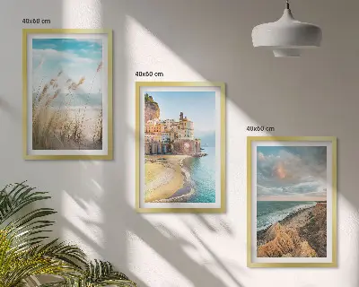 Set of 3 framed wall art pieces featuring landscape scenes of beaches cliffs and cities