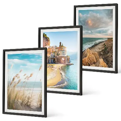 Set of 3 framed wall art pieces featuring landscape scenes of beaches cliffs and cities