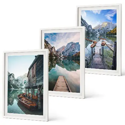 Three-piece wall art set featuring lake, mountains, and wooden boats