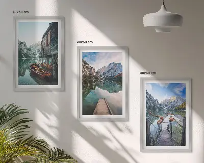 Three-piece wall art set featuring lake, mountains, and wooden boats