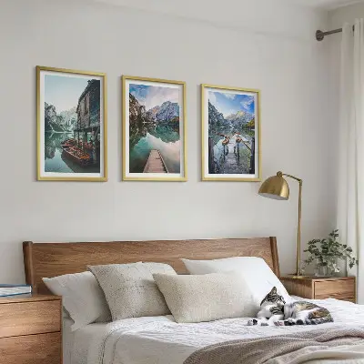 Three-piece wall art set featuring lake, mountains, and wooden boats