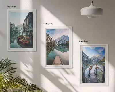 Three-piece wall art set featuring lake, mountains, and wooden boats