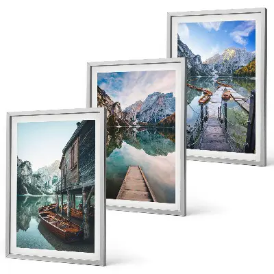 Three-piece wall art set featuring lake, mountains, and wooden boats