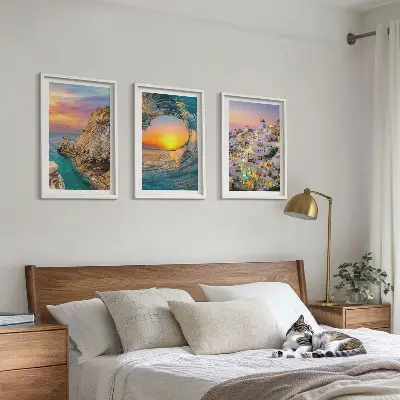 Three-piece wall art set featuring sea waves and white houses in Santorini