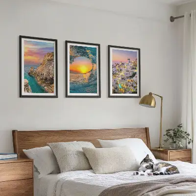 Three-piece wall art set featuring sea waves and white houses in Santorini