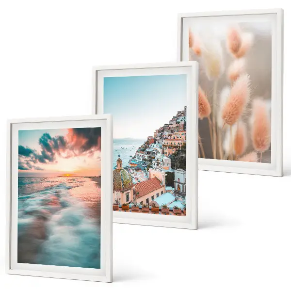Wall art set featuring a seaside sunset with houses and flowers
