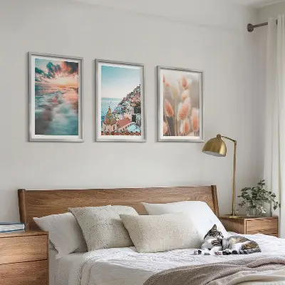 Wall art set featuring a seaside sunset with houses and flowers