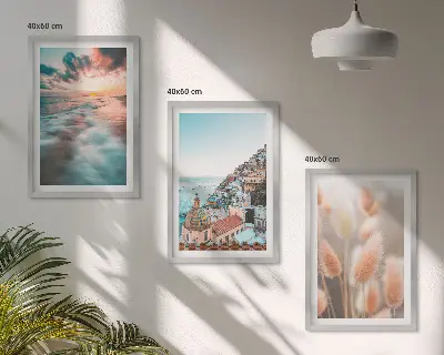 Wall art set featuring a seaside sunset with houses and flowers