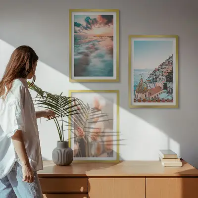 Wall art set featuring a seaside sunset with houses and flowers