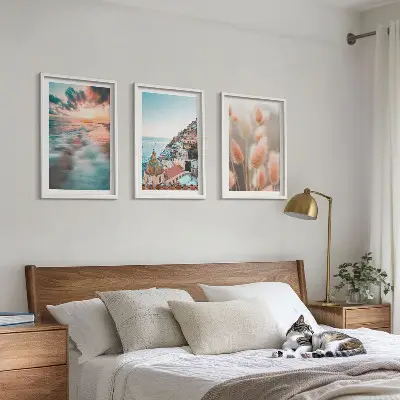 Wall art set featuring a seaside sunset with houses and flowers