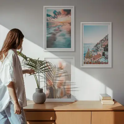 Wall art set featuring a seaside sunset with houses and flowers