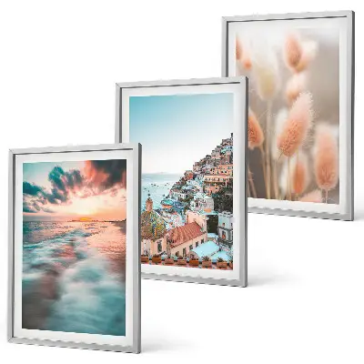 Wall art set featuring a seaside sunset with houses and flowers