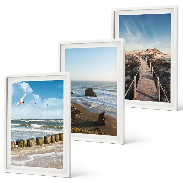 Set of 3 framed wall art pieces featuring a beach with waves, sky, and a pier walk