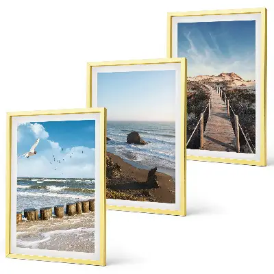 Set of 3 framed wall art pieces featuring a beach with waves, sky, and a pier walk