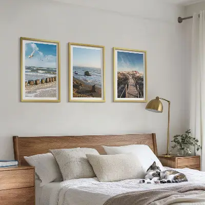 Set of 3 framed wall art pieces featuring a beach with waves, sky, and a pier walk