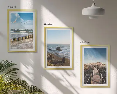 Set of 3 framed wall art pieces featuring a beach with waves, sky, and a pier walk