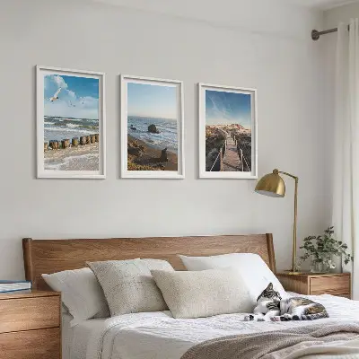 Set of 3 framed wall art pieces featuring a beach with waves, sky, and a pier walk