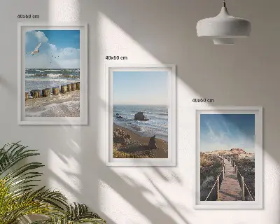 Set of 3 framed wall art pieces featuring a beach with waves, sky, and a pier walk