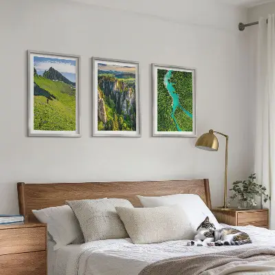Three-piece wall art set featuring green mountains and river rocks