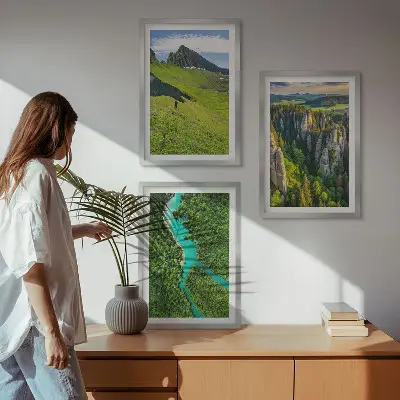 Three-piece wall art set featuring green mountains and river rocks
