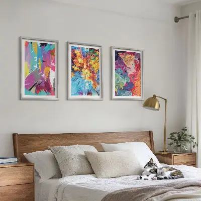 Three-piece abstract wall art set with colorful paint patterns