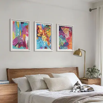 Three-piece abstract wall art set with colorful paint patterns