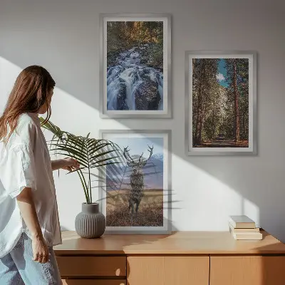 Three-piece wall art set featuring a waterfall in a mountain forest with deer and nature scenery